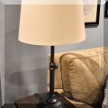 DL08. One of a pair of brass colored industrial style table lamps.  
